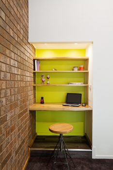 Lime green feature wall study nook in contemporary living 